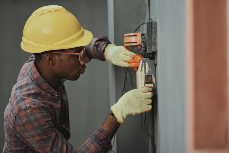 An electrician inspecting wiring installation