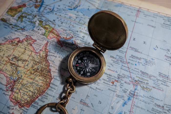 A compass resting on a map